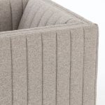 This chairs sloping arms and thick reversible seat cushion with sinuous no-sag springs. Highlighted by double material, this chair will add comfort and beauty to any room.